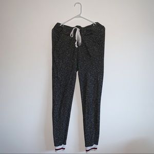 Grey Joggers With White & Red Striped Bottoms